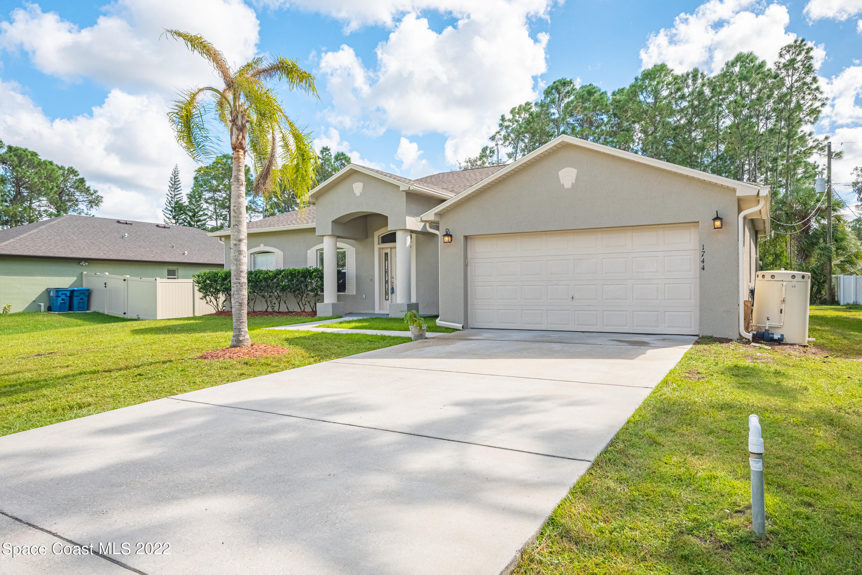 1744 Hydrangea Road Palm Bay, FL 32907 - Photo 2 of 34 a house view with a outdoor space