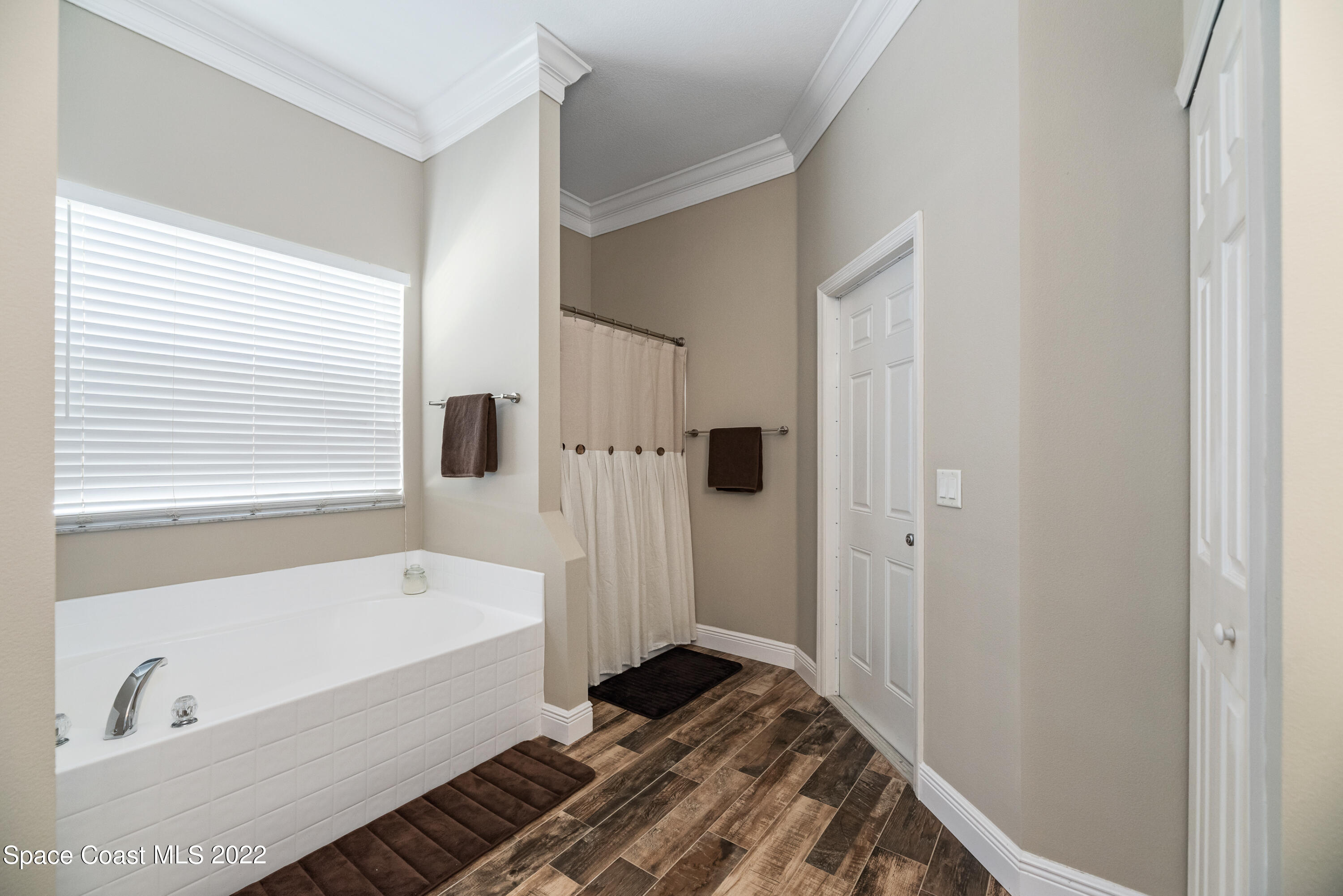 1744 Hydrangea Road Palm Bay, FL 32907 - Photo 29 of 34 a bathroom with a bathtub and a shower