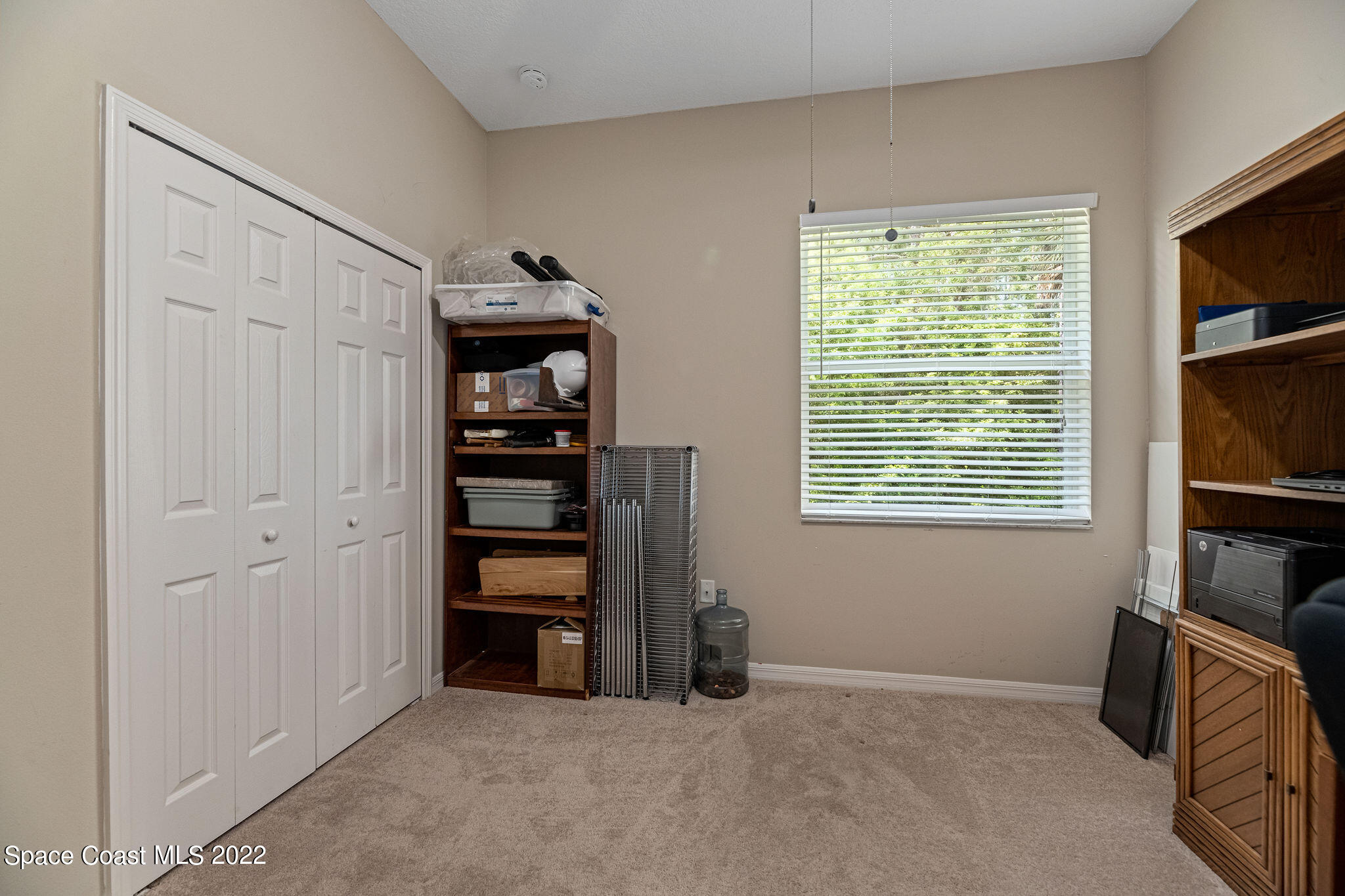 1744 Hydrangea Road Palm Bay, FL 32907 - Photo 31 of 34 an empty room with furniture and window