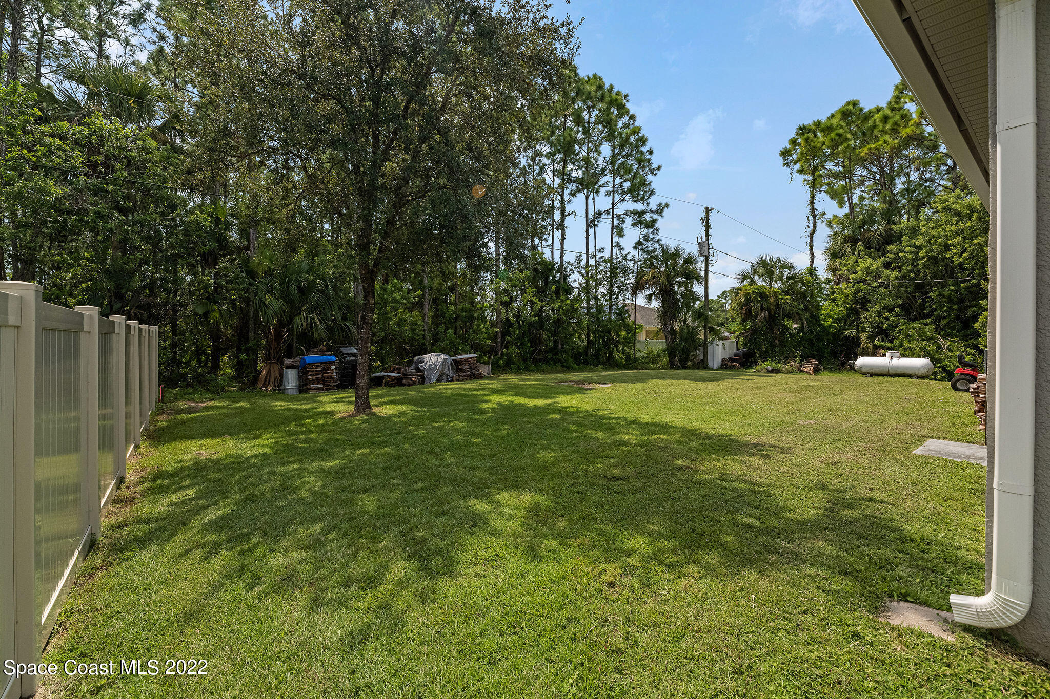 1744 Hydrangea Road Palm Bay, FL 32907 - Photo 8 of 34 a view of a garden with a slide
