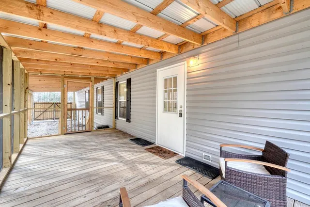 a view of a patio with wooden floor
