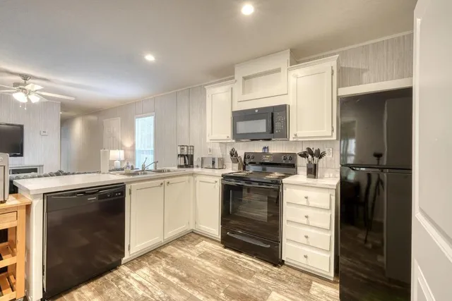 a kitchen with a sink stove and refrigerator