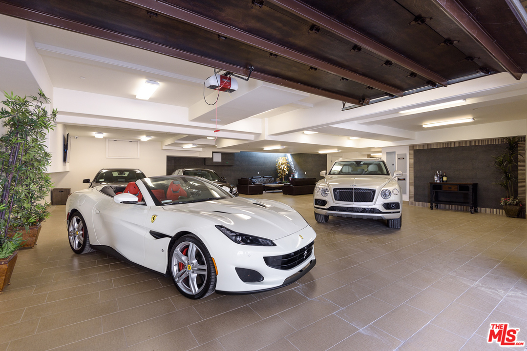 2175 Summitridge Drive Beverly Hills, CA 90210 - Photo 50 of 51 a car and car parked in a parking