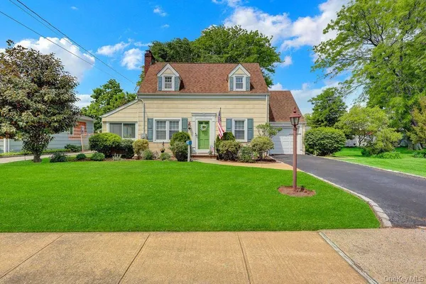 a front view of house with garden