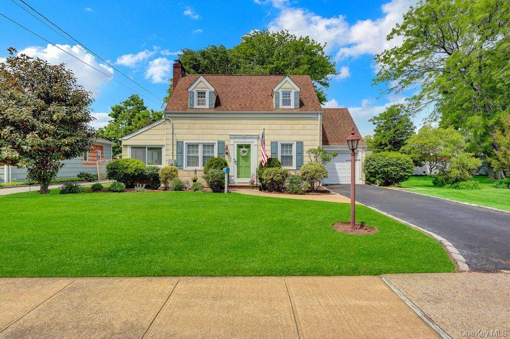 5 Newell Road Merrick, NY 11566 - Photo 1 of 19 a front view of house with garden