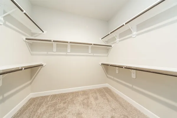 a view of an empty walk in closet
