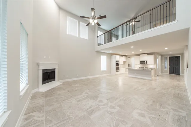 a view of an empty room with a fireplace