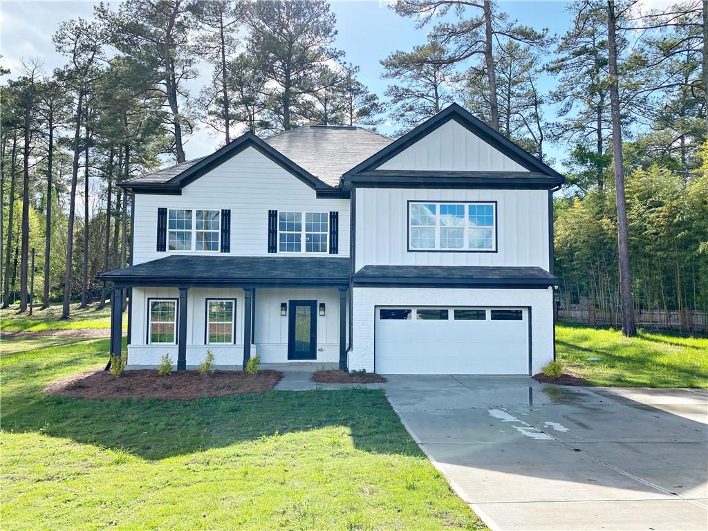 393 Corinth Church Road Winder, GA 30680 - Photo 1 of 1 a front view of a house with garden