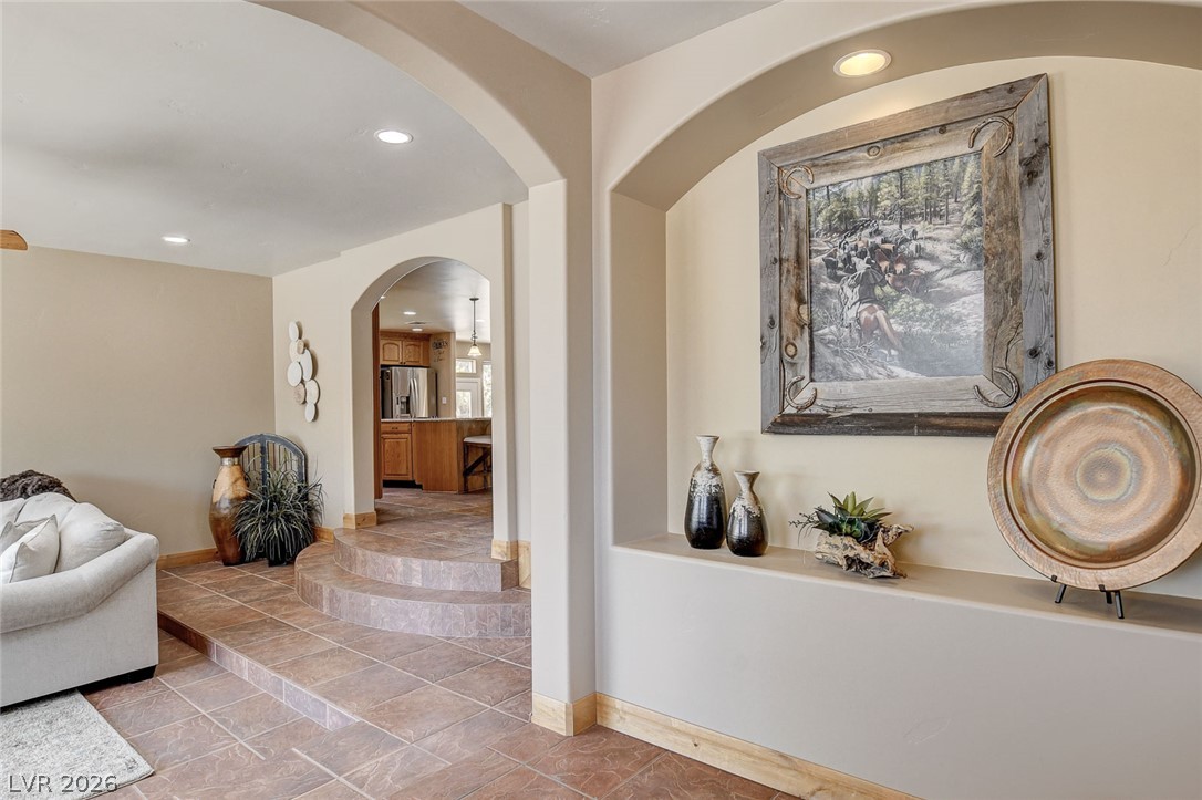 1950 Bowman Road Logandale, NV 89021 - Photo 6 of 81 Archways and tiled floors connect distinct living spaces with ease.