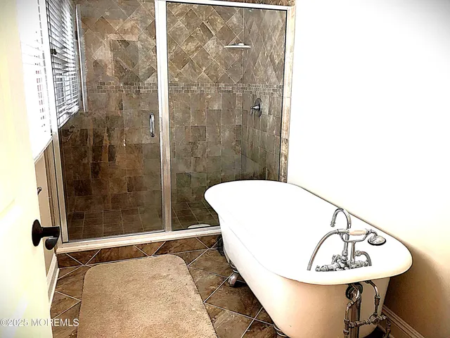 a bathroom with a sink and shower