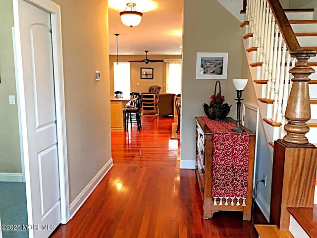 a view of living room with furniture and wooden floor