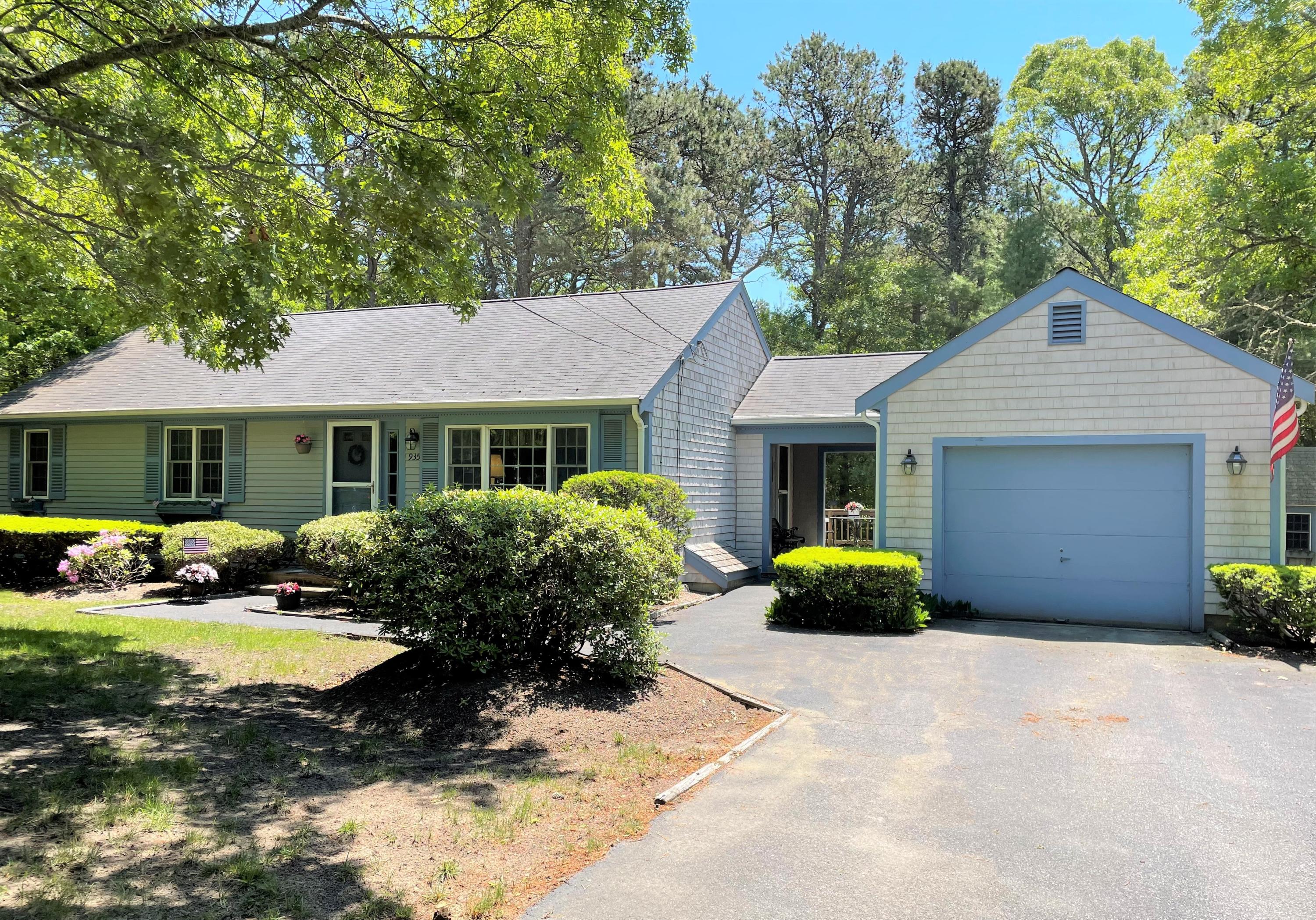 935 Bumps River Road Centerville, MA 02632 - Photo 2 of 14 a front view of a house with garden