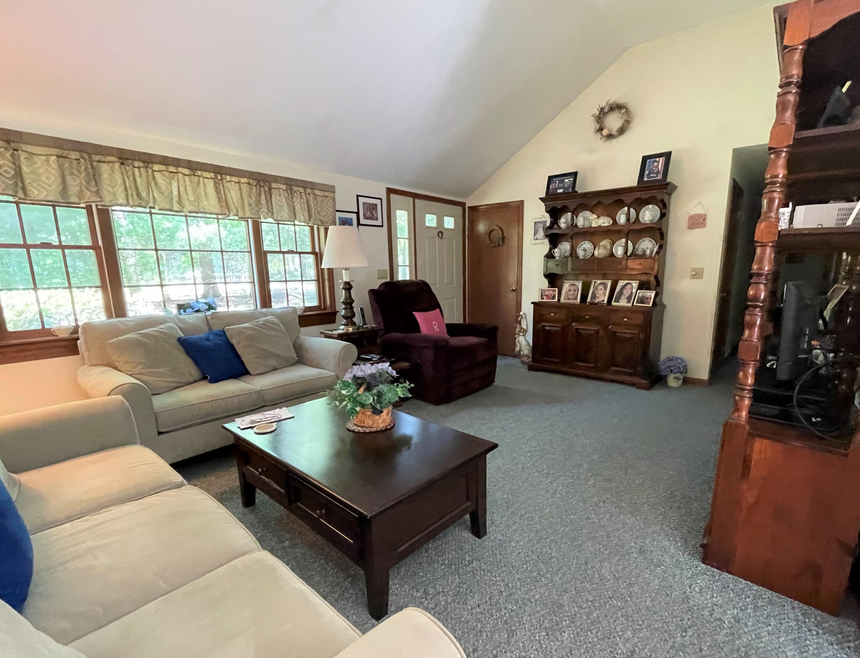 935 Bumps River Road Centerville, MA 02632 - Photo 3 of 14 a living room with furniture and a flat screen tv