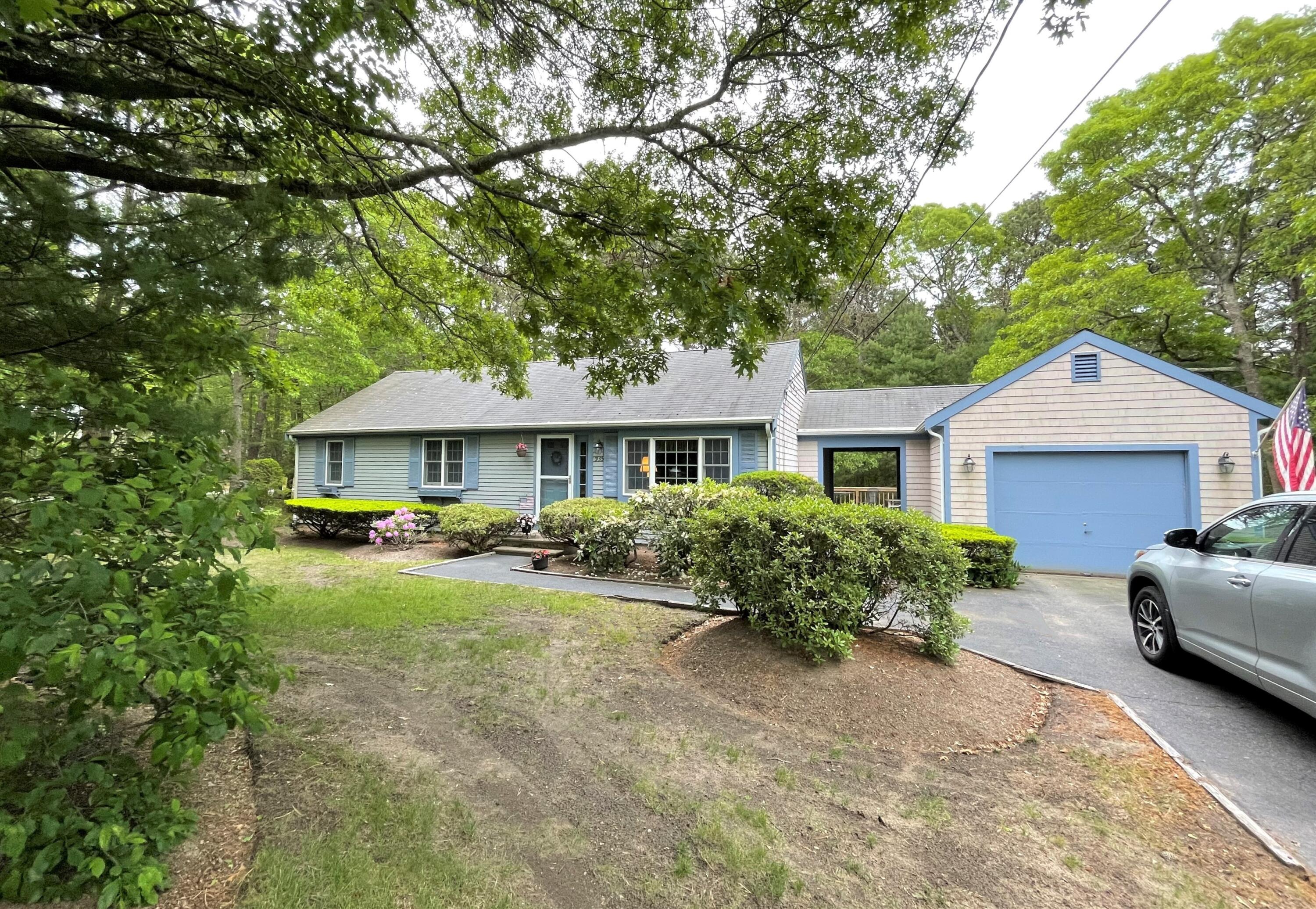 935 Bumps River Road Centerville, MA 02632 - Photo 4 of 14 a front view of a house with yard and porch