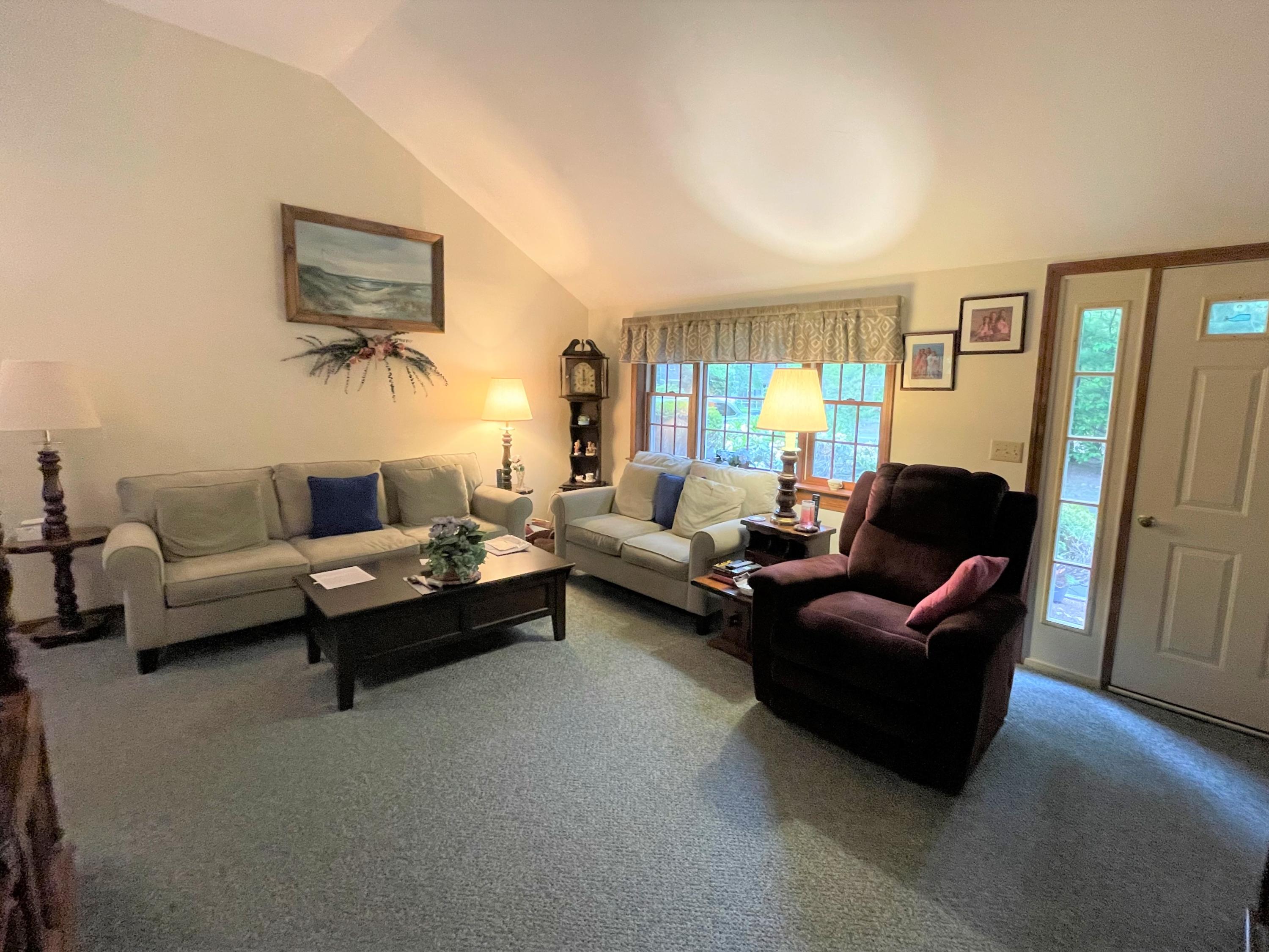 935 Bumps River Road Centerville, MA 02632 - Photo 5 of 14 a living room with furniture and a flat screen tv