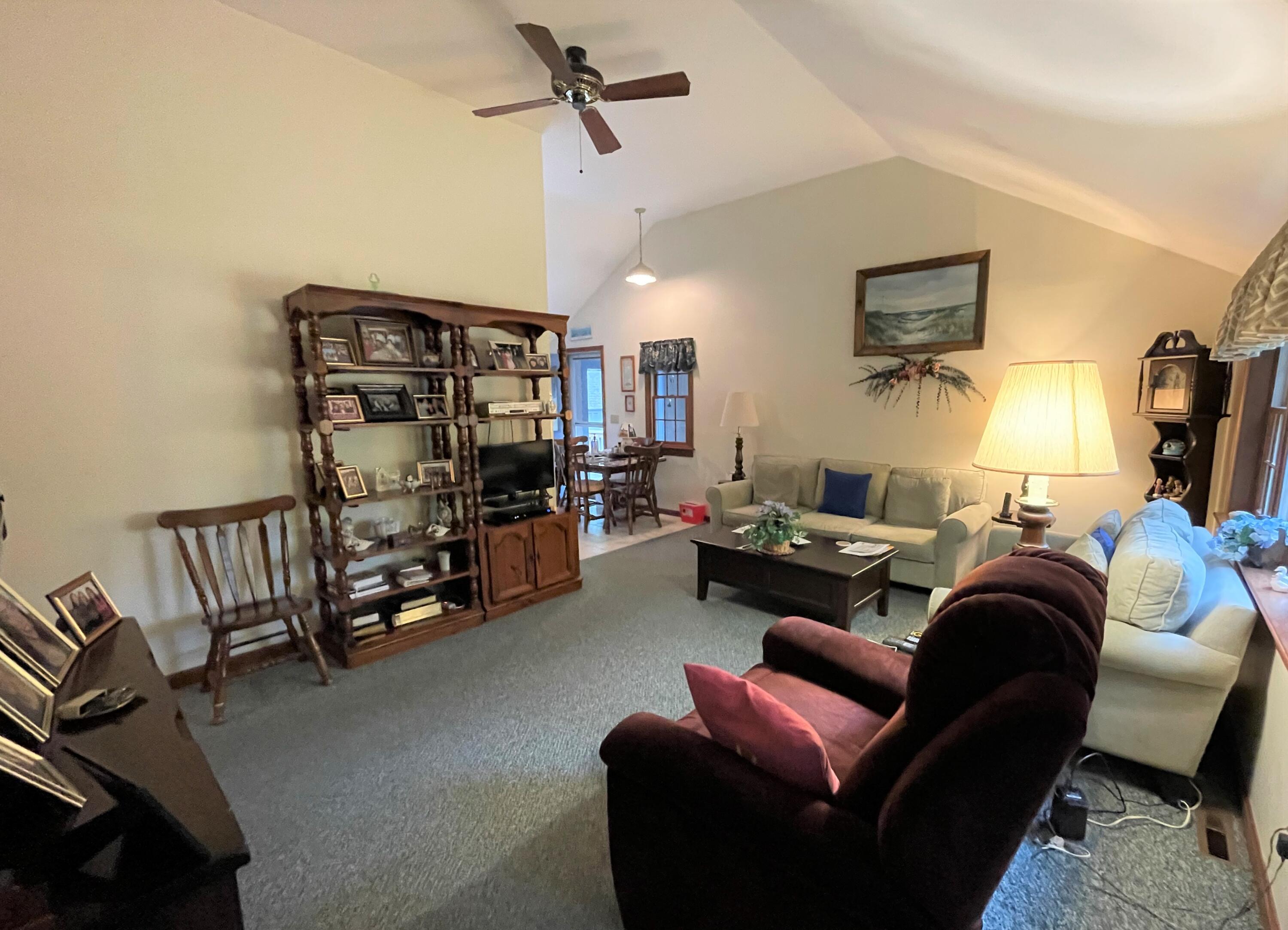 935 Bumps River Road Centerville, MA 02632 - Photo 6 of 14 a living room with furniture and a flat screen tv
