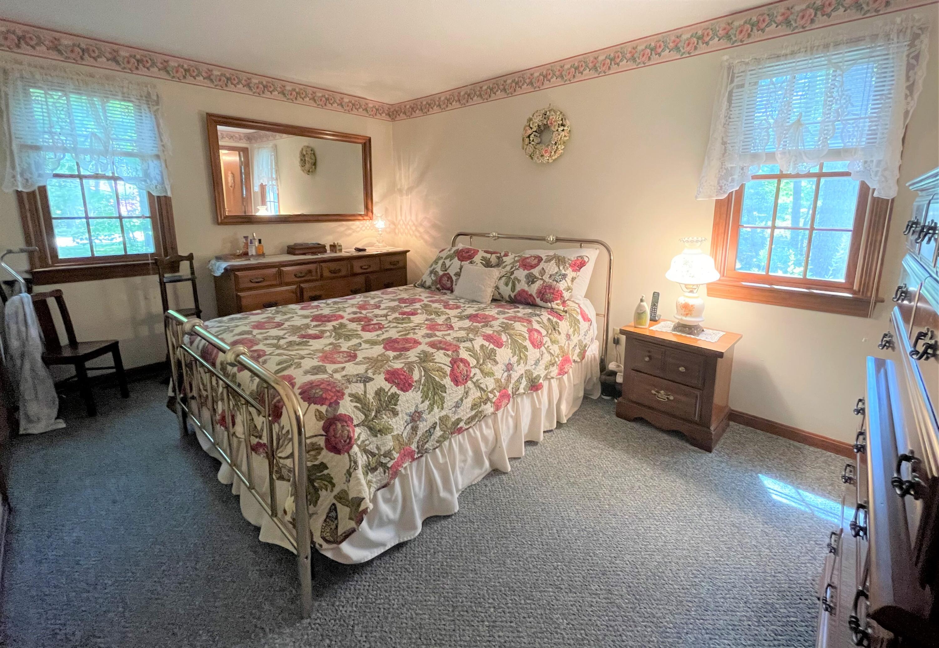 935 Bumps River Road Centerville, MA 02632 - Photo 8 of 14 a room with a bed and a table