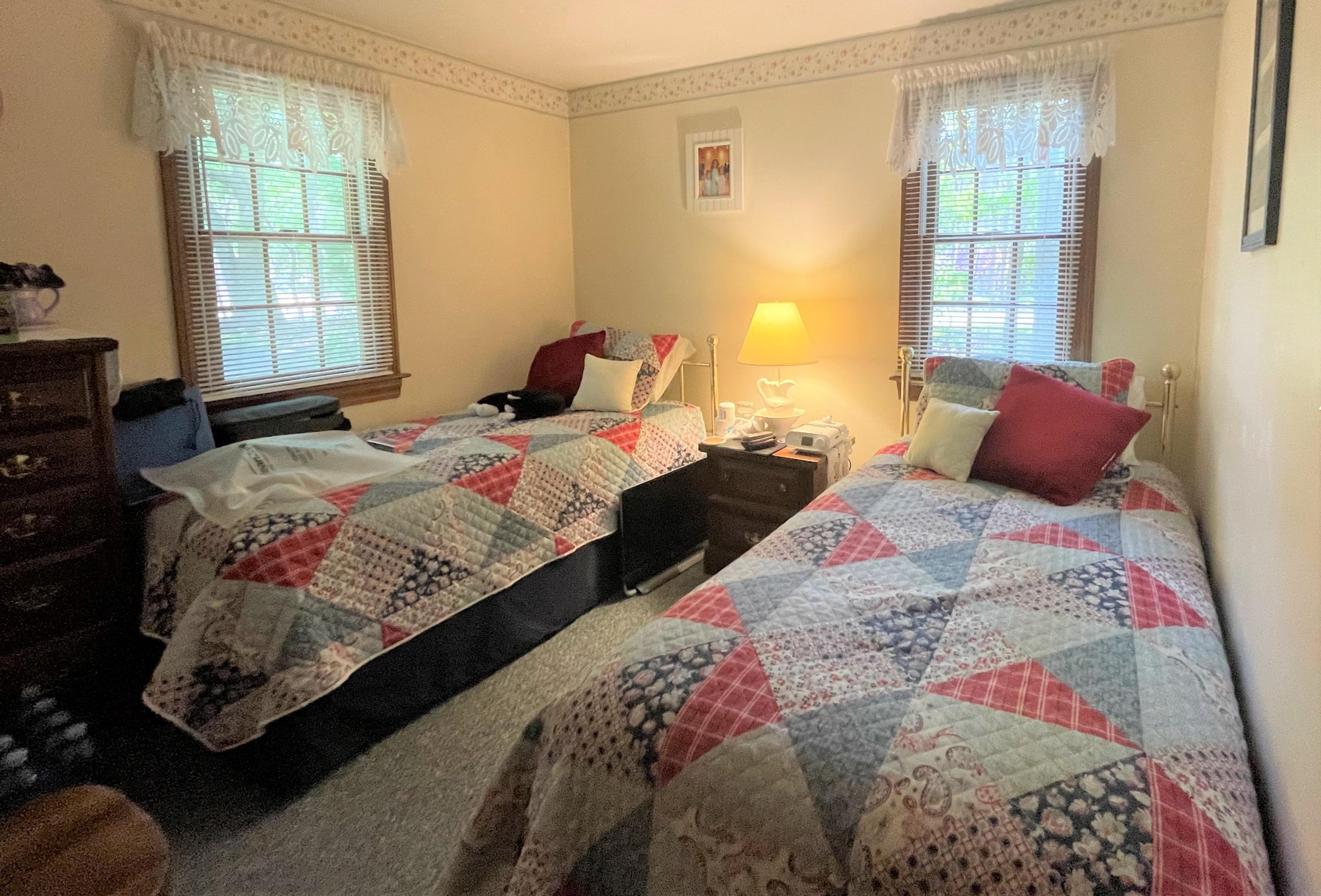 935 Bumps River Road Centerville, MA 02632 - Photo 10 of 14 a bedroom with bed and a window