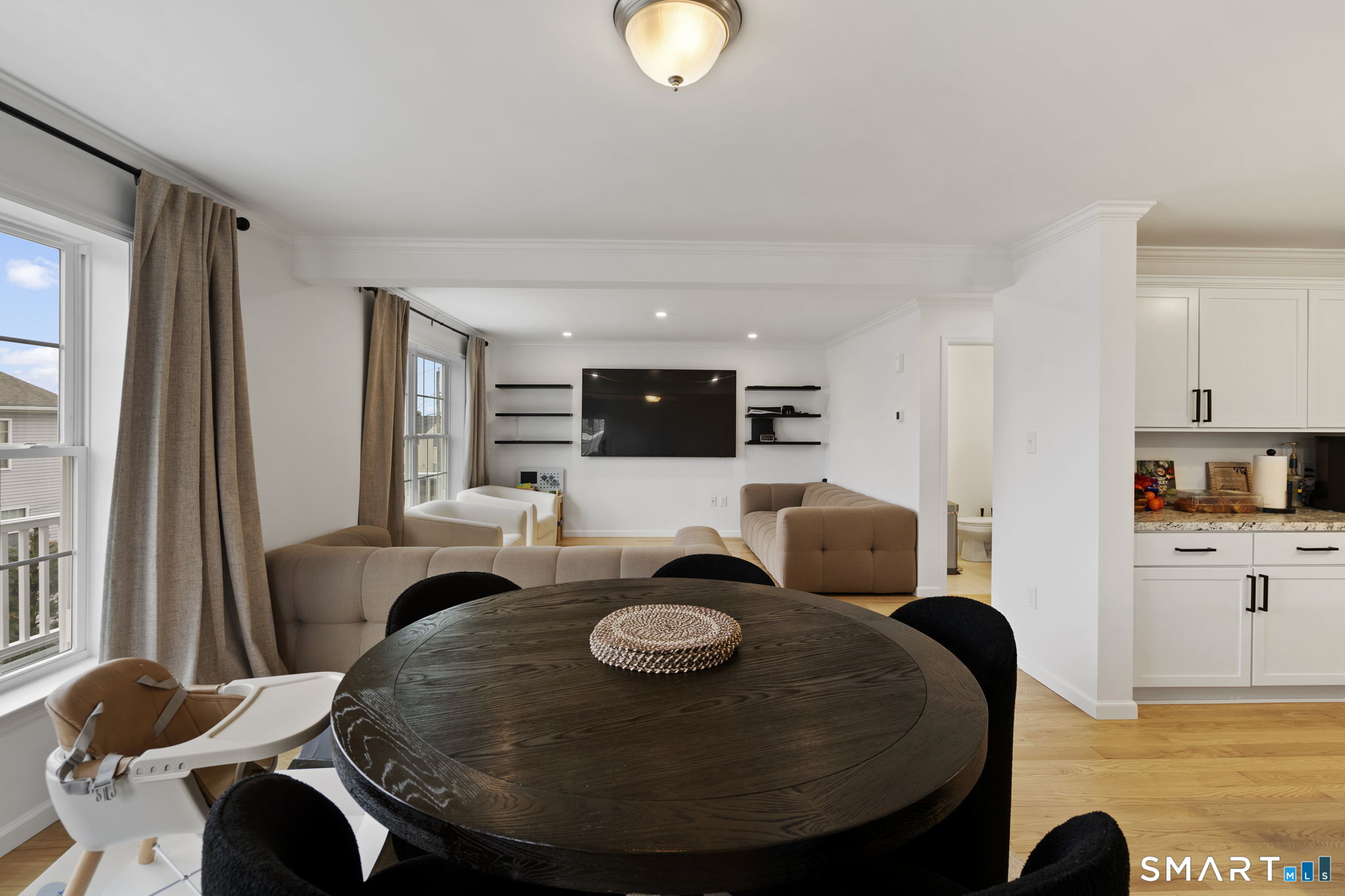 156 Dayton Road Bridgeport, CT 06606 - Photo 13 of 28 a view of a dining room with furniture and wooden floor