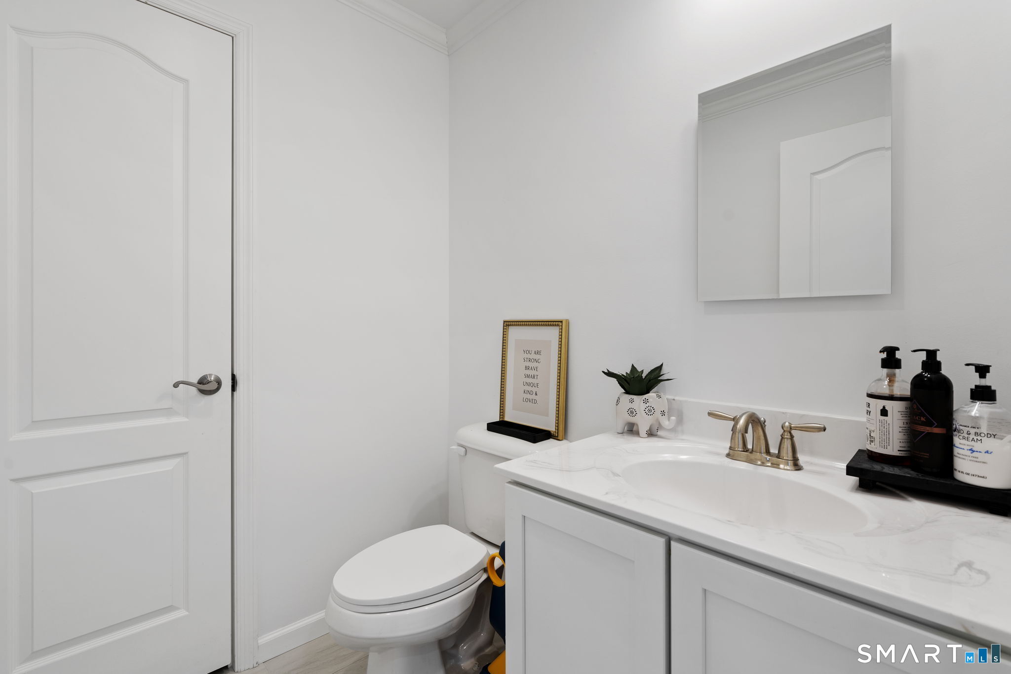 156 Dayton Road Bridgeport, CT 06606 - Photo 14 of 28 a bathroom with a sink a toilet and vanity
