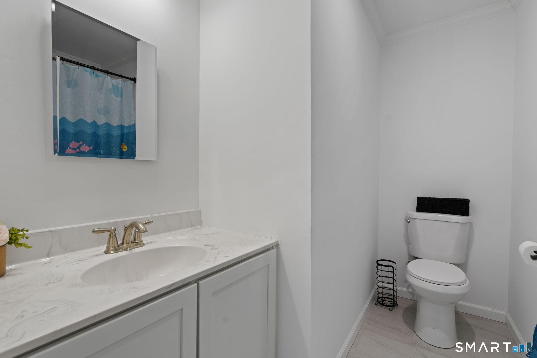 156 Dayton Road Bridgeport, CT 06606 - Photo 15 of 28 a bathroom with a toilet sink and mirror