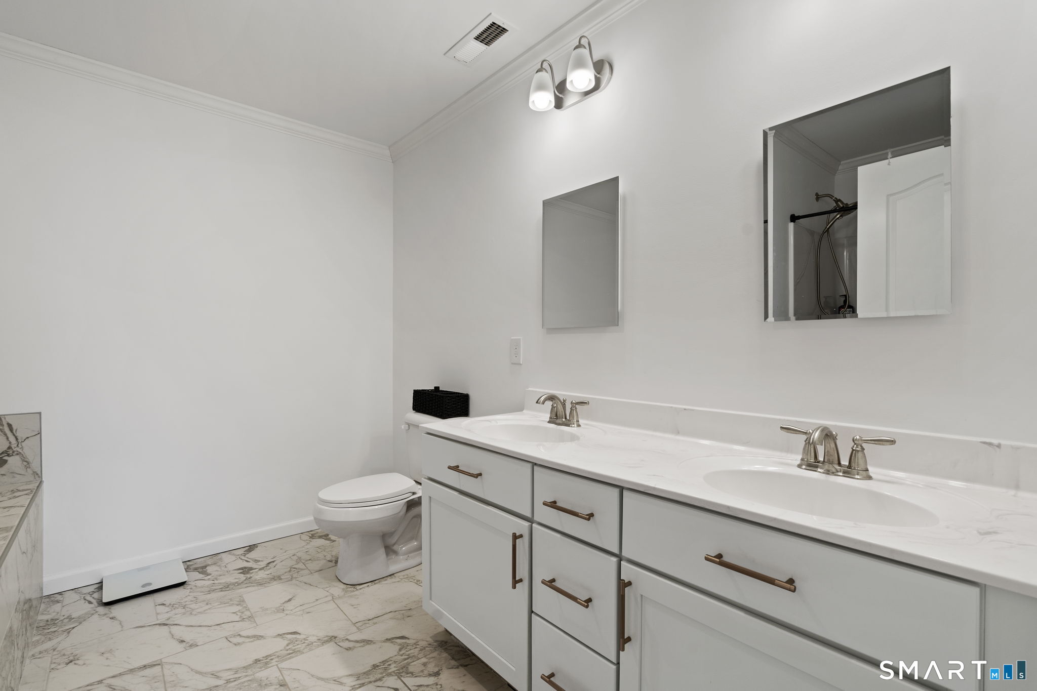 156 Dayton Road Bridgeport, CT 06606 - Photo 19 of 28 a bathroom with a toilet sink and mirror
