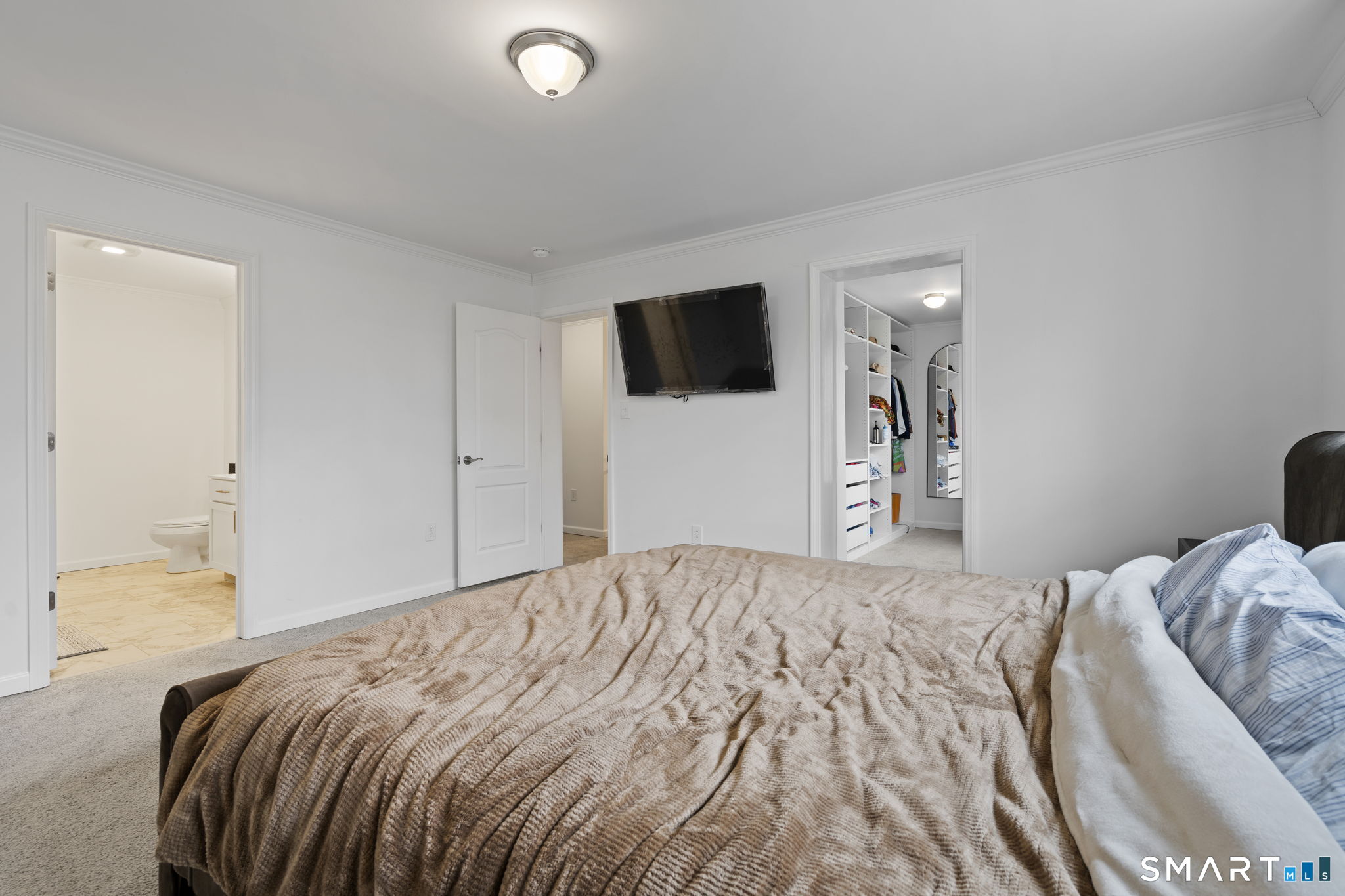 156 Dayton Road Bridgeport, CT 06606 - Photo 20 of 28 a bedroom with a bed and a flat screen tv