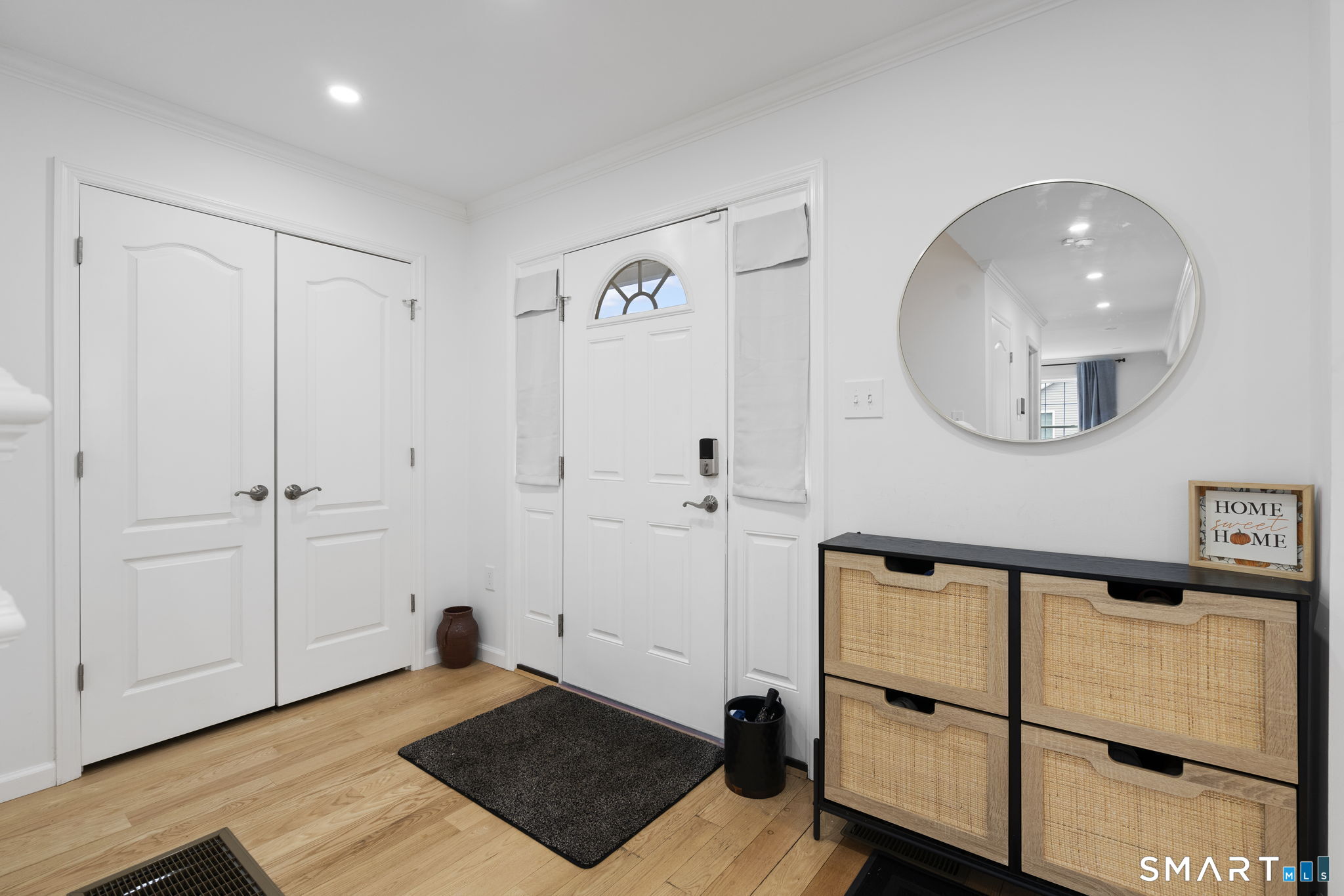 156 Dayton Road Bridgeport, CT 06606 - Photo 24 of 28 a view of a livingroom with wooden floor and a ceiling fan