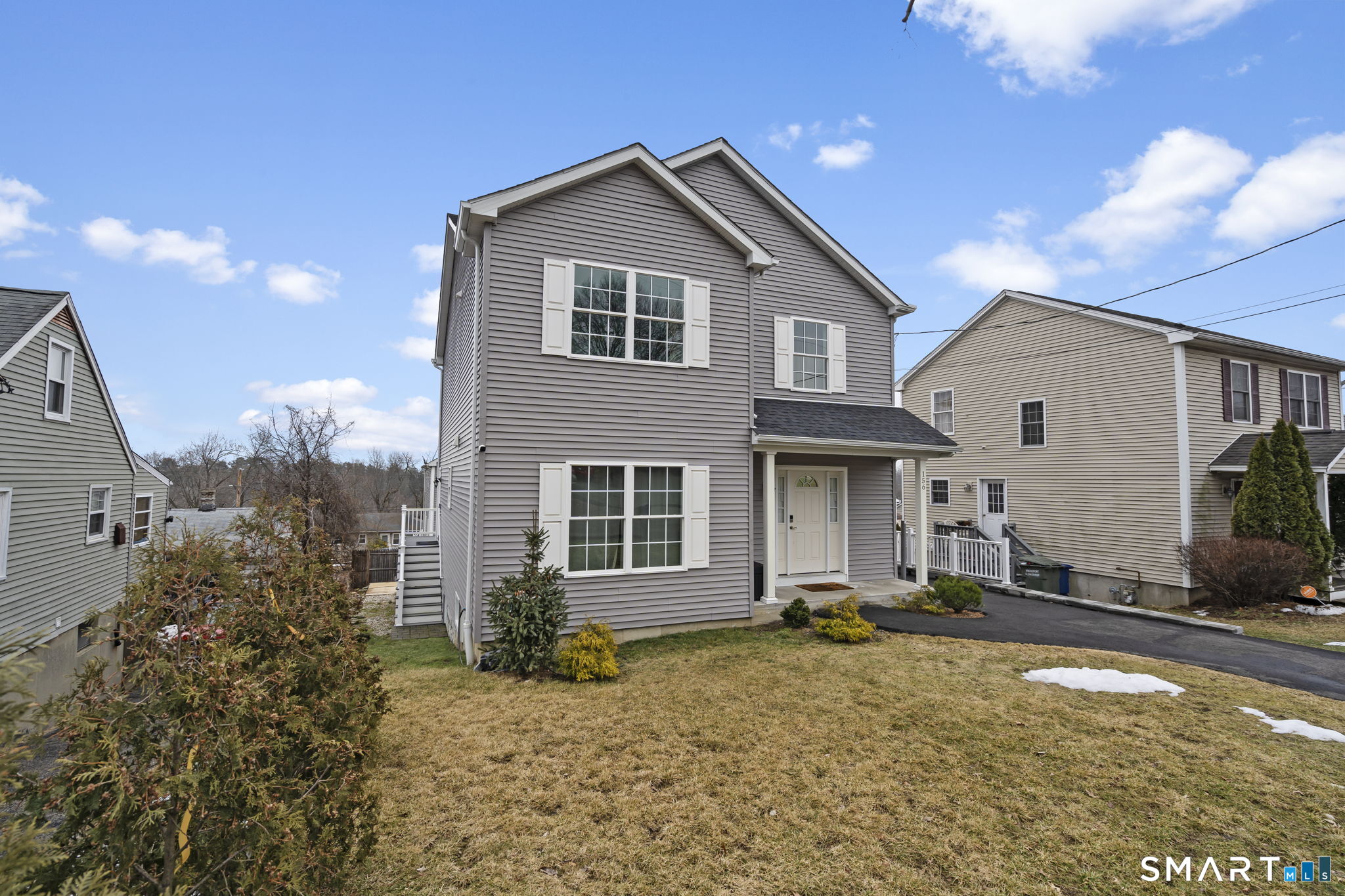 156 Dayton Road Bridgeport, CT 06606 - Photo 3 of 28 a front view of a house with a yard