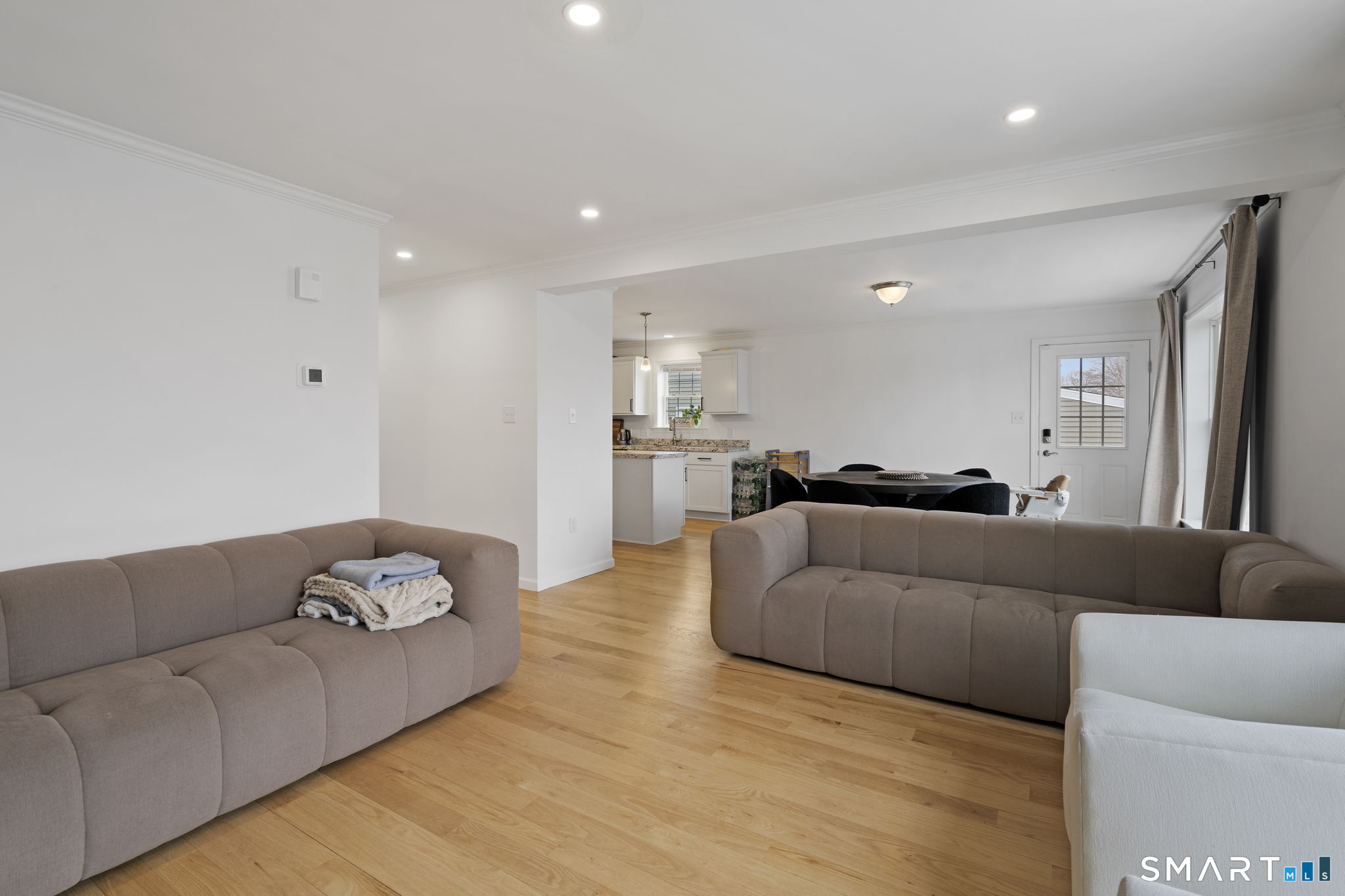 156 Dayton Road Bridgeport, CT 06606 - Photo 4 of 28 a living room with furniture and a couch
