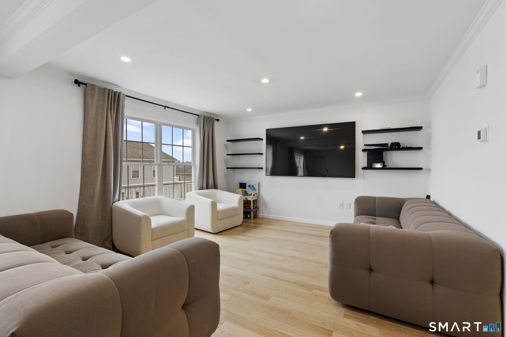 156 Dayton Road Bridgeport, CT 06606 - Photo 5 of 28 a living room with furniture and a flat screen tv