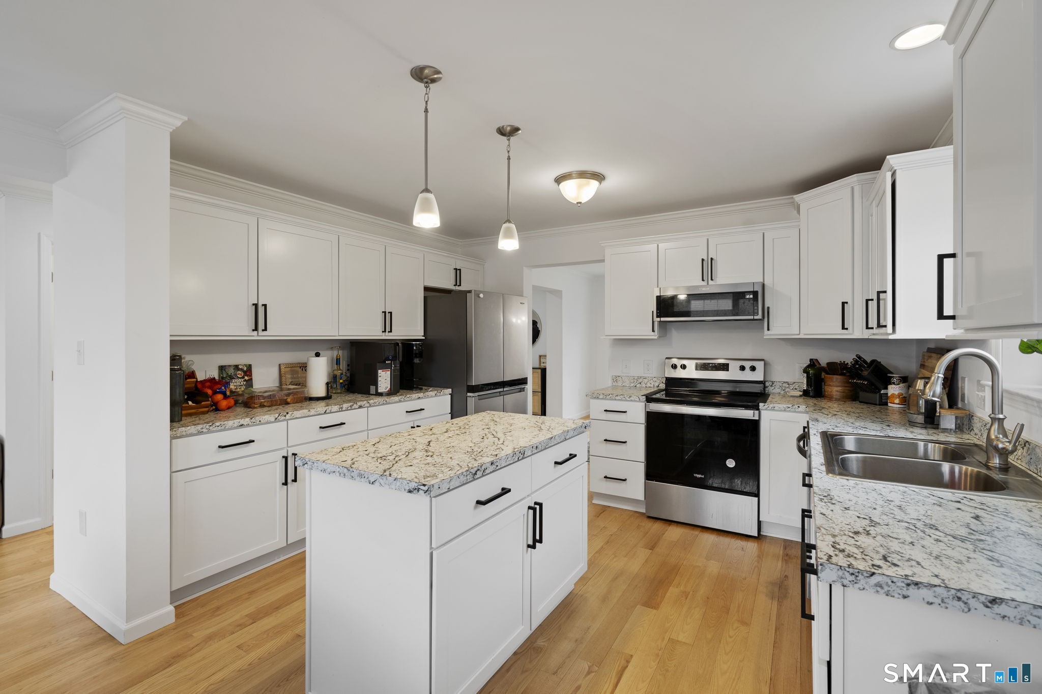 156 Dayton Road Bridgeport, CT 06606 - Photo 9 of 28 a kitchen with stainless steel appliances granite countertop a refrigerator stove microwave and sink
