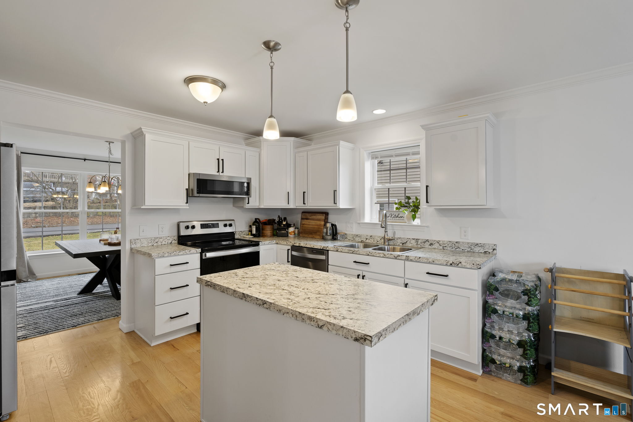 156 Dayton Road Bridgeport, CT 06606 - Photo 10 of 28 a kitchen with stainless steel appliances kitchen island granite countertop a sink a stove a refrigerator and cabinets