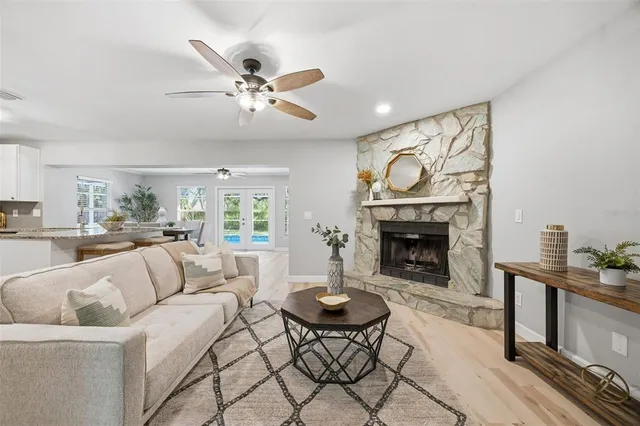 a living room with furniture and a fireplace