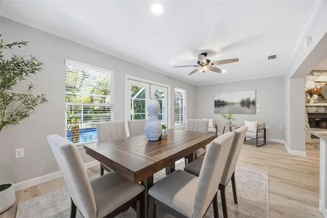 a view of a dining room with furniture window and wooden floor