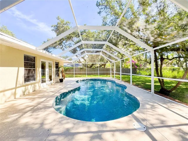 a view of a swimming pool with a patio