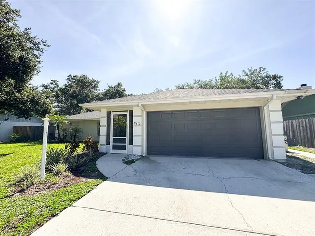a front view of house with yard outdoor seating and barbeque oven