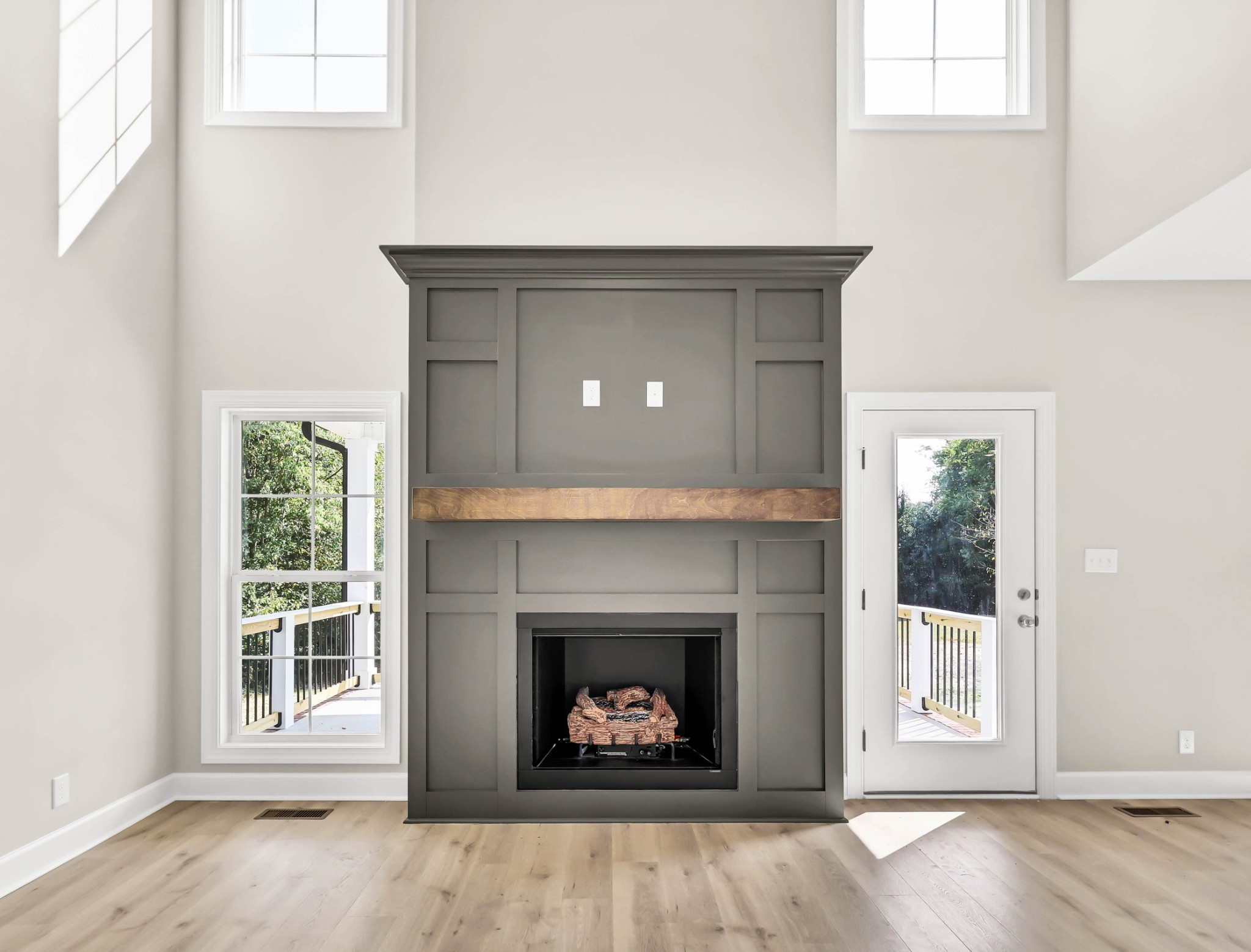 262 Rossview Road Clarksville, TN 37043 - Photo 12 of 43 an empty room with a fireplace and windows