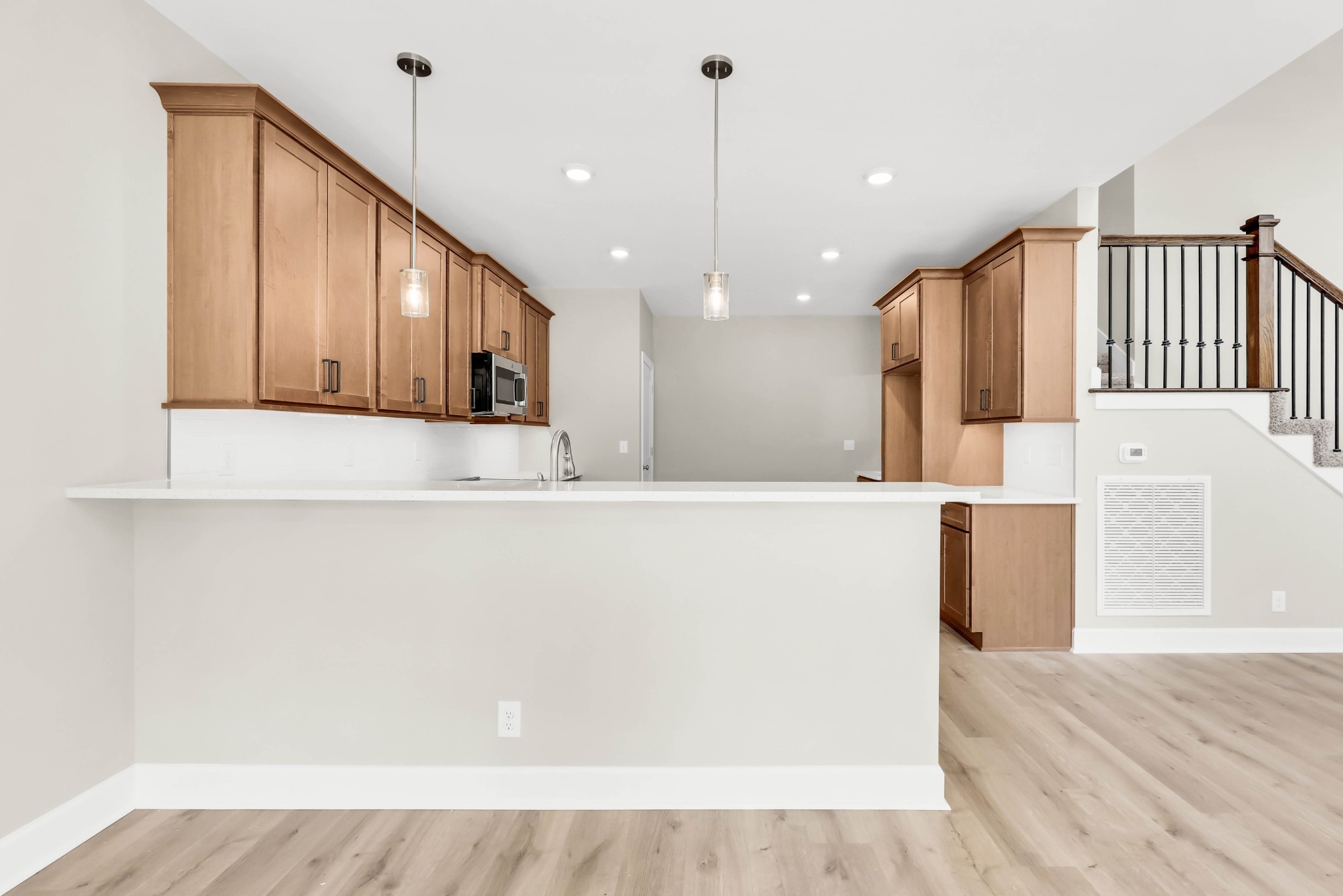 262 Rossview Road Clarksville, TN 37043 - Photo 14 of 43 a view of a kitchen with kitchen island wooden floor center island and stainless steel appliances