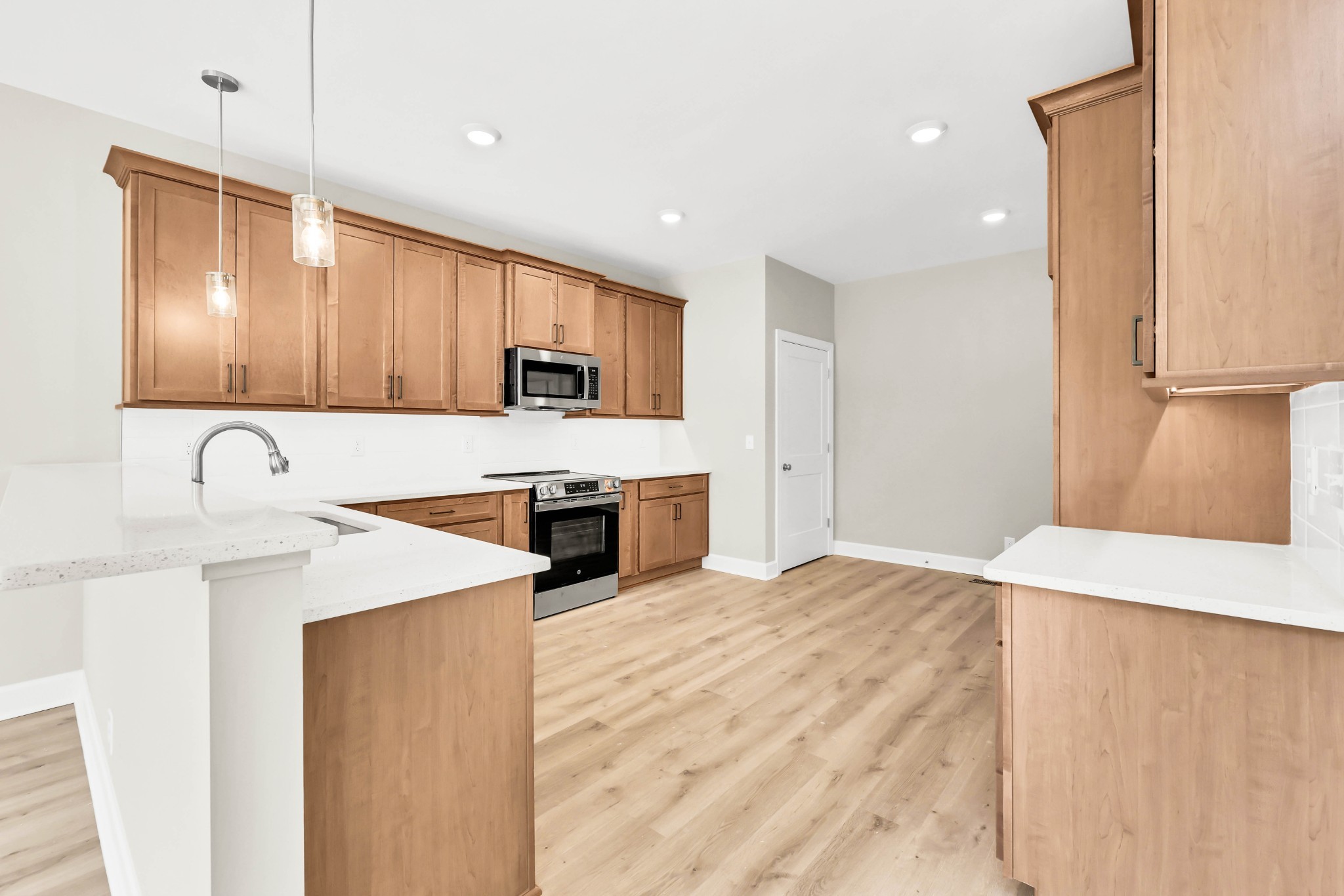 262 Rossview Road Clarksville, TN 37043 - Photo 16 of 43 a kitchen with granite countertop a sink stainless steel appliances and white cabinets