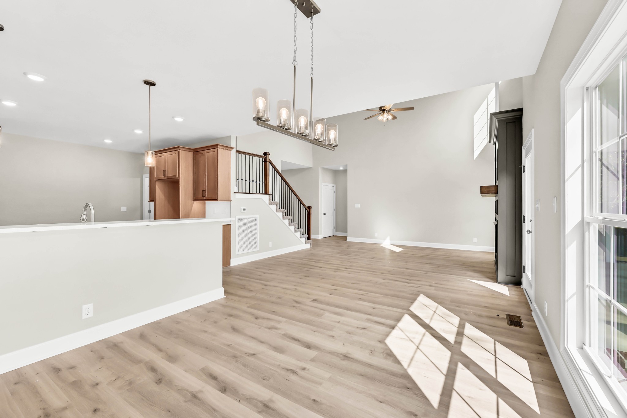 262 Rossview Road Clarksville, TN 37043 - Photo 18 of 43 a view of a kitchen with wooden floor and a ceiling fan