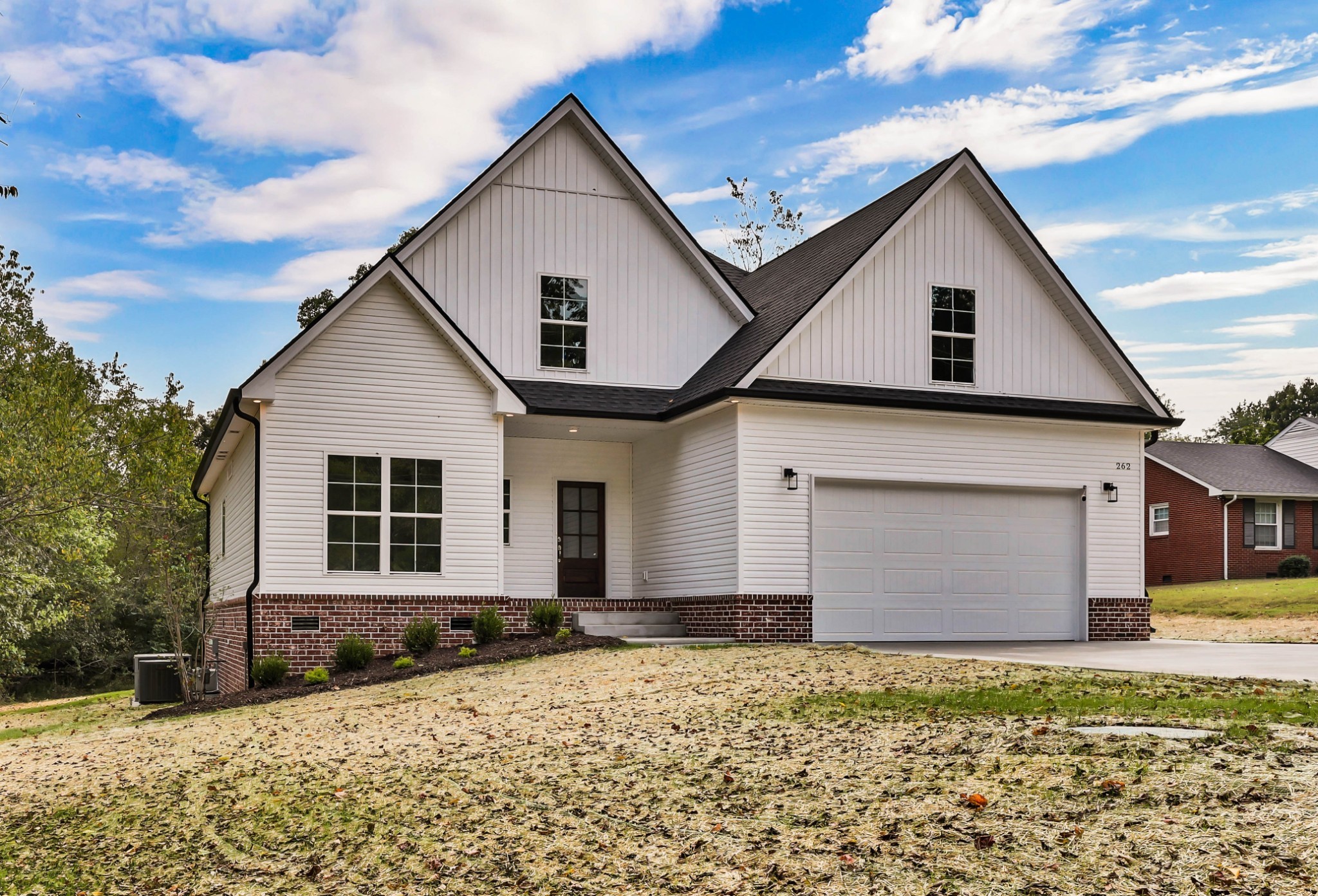 262 Rossview Road Clarksville, TN 37043 - Photo 2 of 43 a front view of a house with a yard