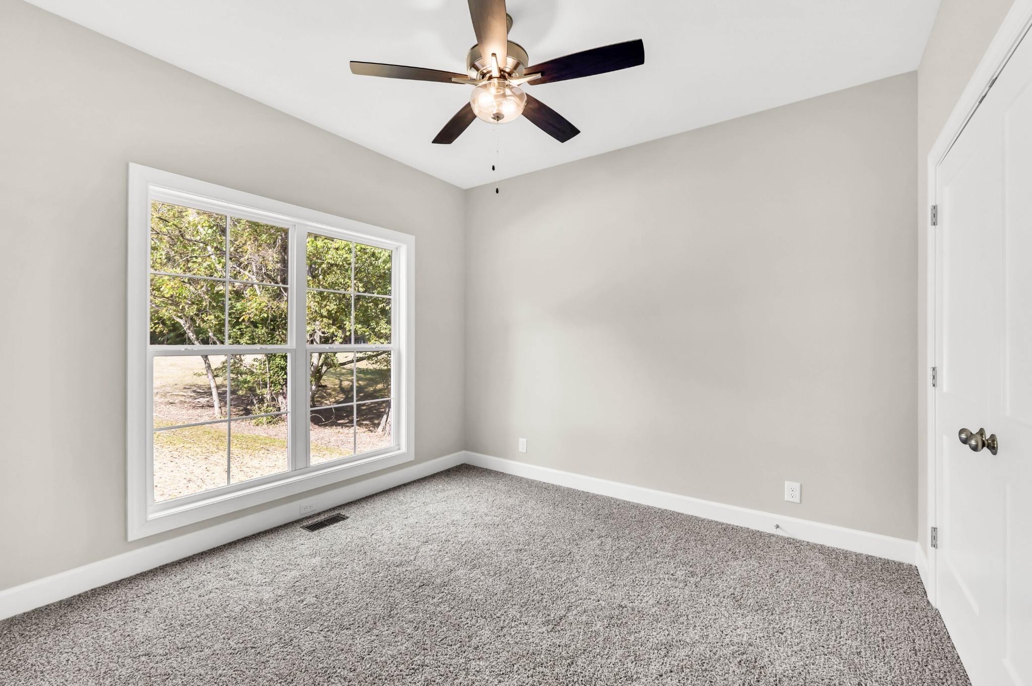 262 Rossview Road Clarksville, TN 37043 - Photo 29 of 43 an empty room with a window and a fan