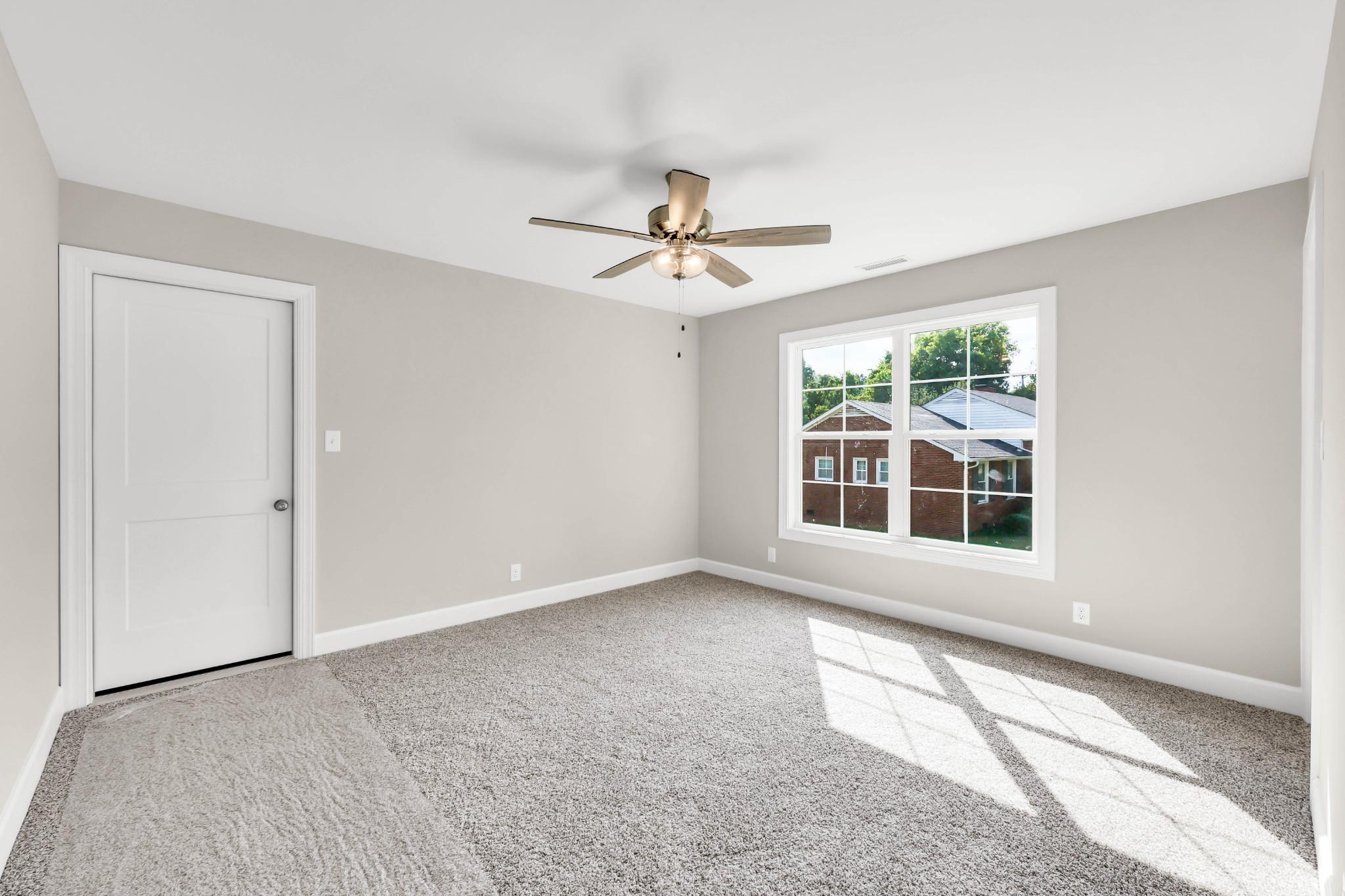 262 Rossview Road Clarksville, TN 37043 - Photo 34 of 43 an empty room with chandelier fan and windows