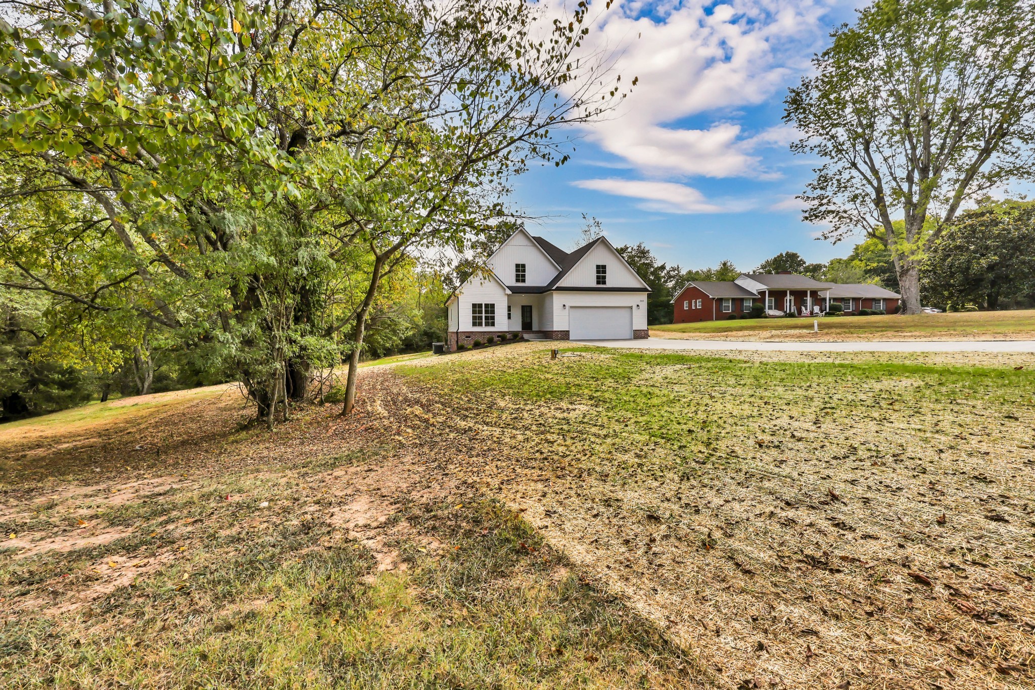 262 Rossview Road Clarksville, TN 37043 - Photo 4 of 43 a view of a large yard with a large tree