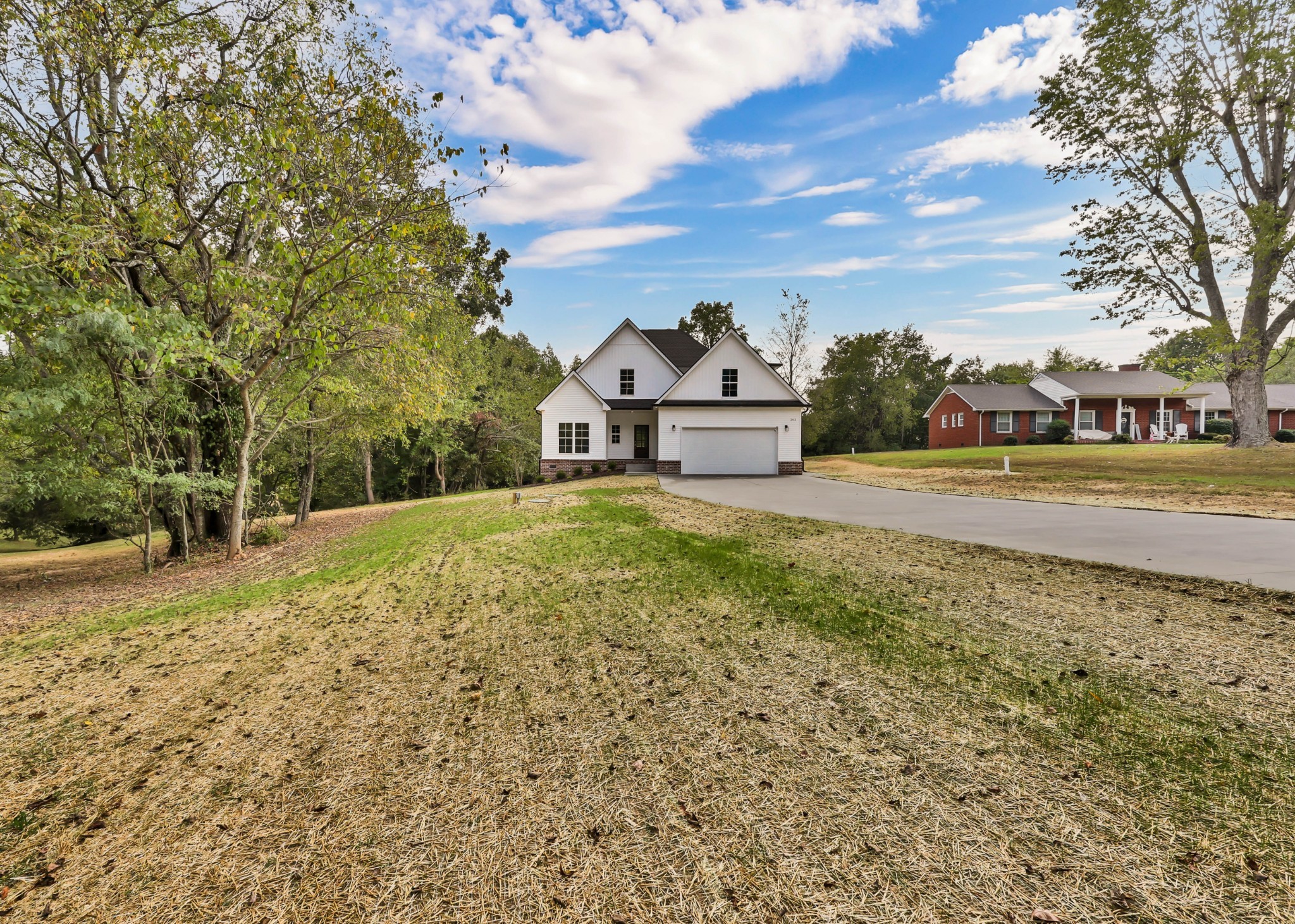 262 Rossview Road Clarksville, TN 37043 - Photo 5 of 43 a view of a field with large trees and a houses