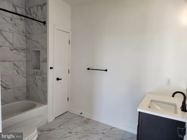 a bathroom with a sink and a bathtub