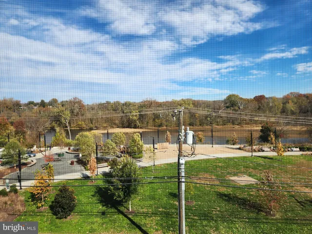 a view of a lake with houses in the back