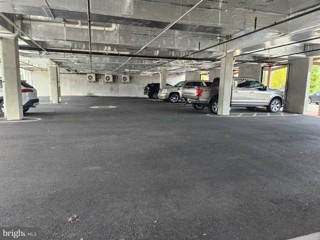 a view of parking garage with cars