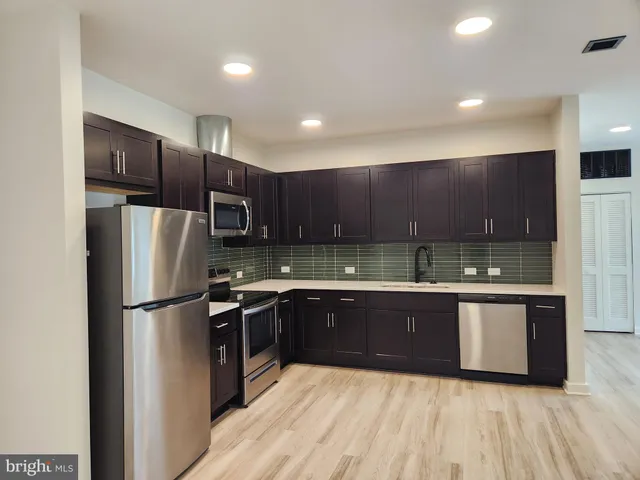 a view of kitchen with wooden floor